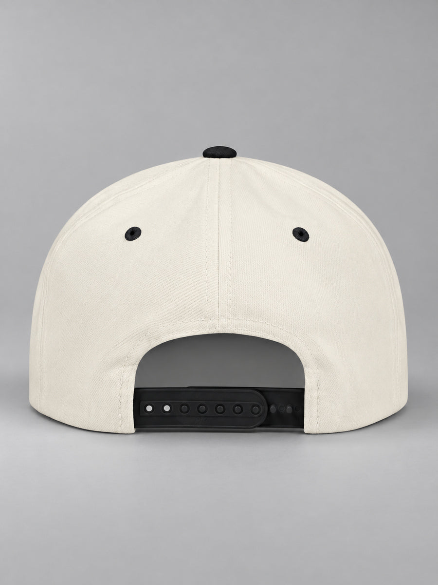 Synthesis Blackout snapback in Natural/Black, rear view showing the adjustable snap closure and blank crown on gray.