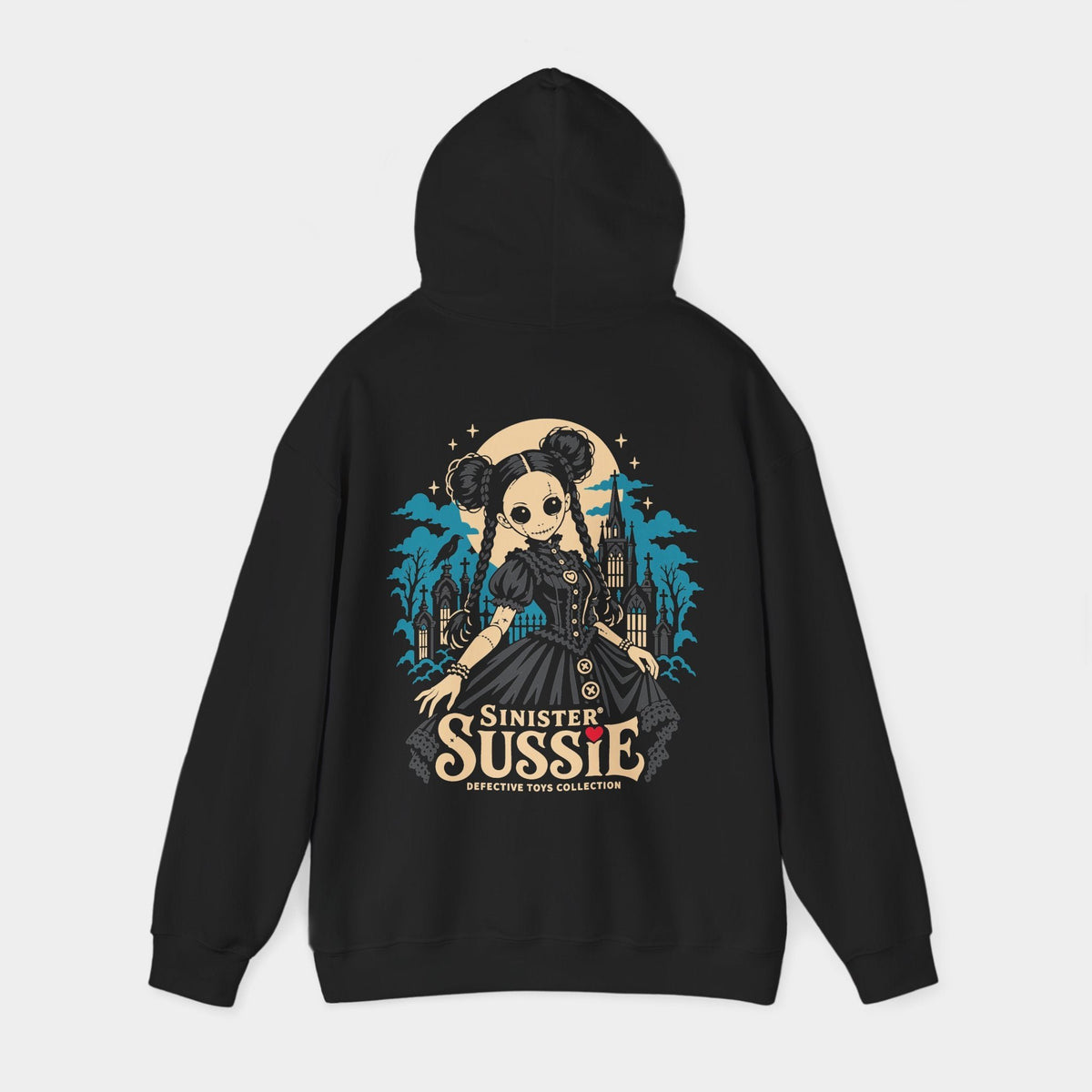 Sinister Sussie black hoodie, hood-raised back view showing a stitched doll with twin hair buns, braids and a charcoal dress before a teal Gothic church and cemetery, with an ivory moon, raven and Sinister Sussie lettering.