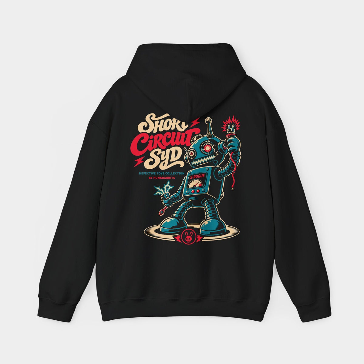 Short Circuit Syd black hoodie, back view showing a teal retro toy robot with spring limbs, loose sparking cables, a chest meter and cream-and-red Short Circuit Syd lettering.