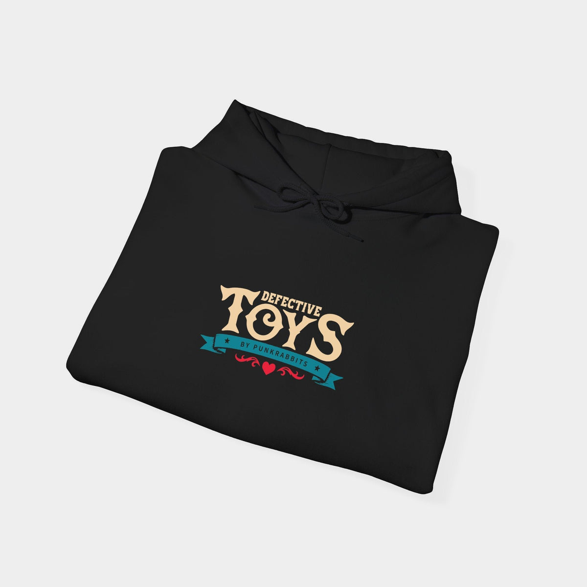 Sinister Sussie black hoodie folded to show cream Defective Toys lettering above a teal Punkrabbits banner and a small red flourish.