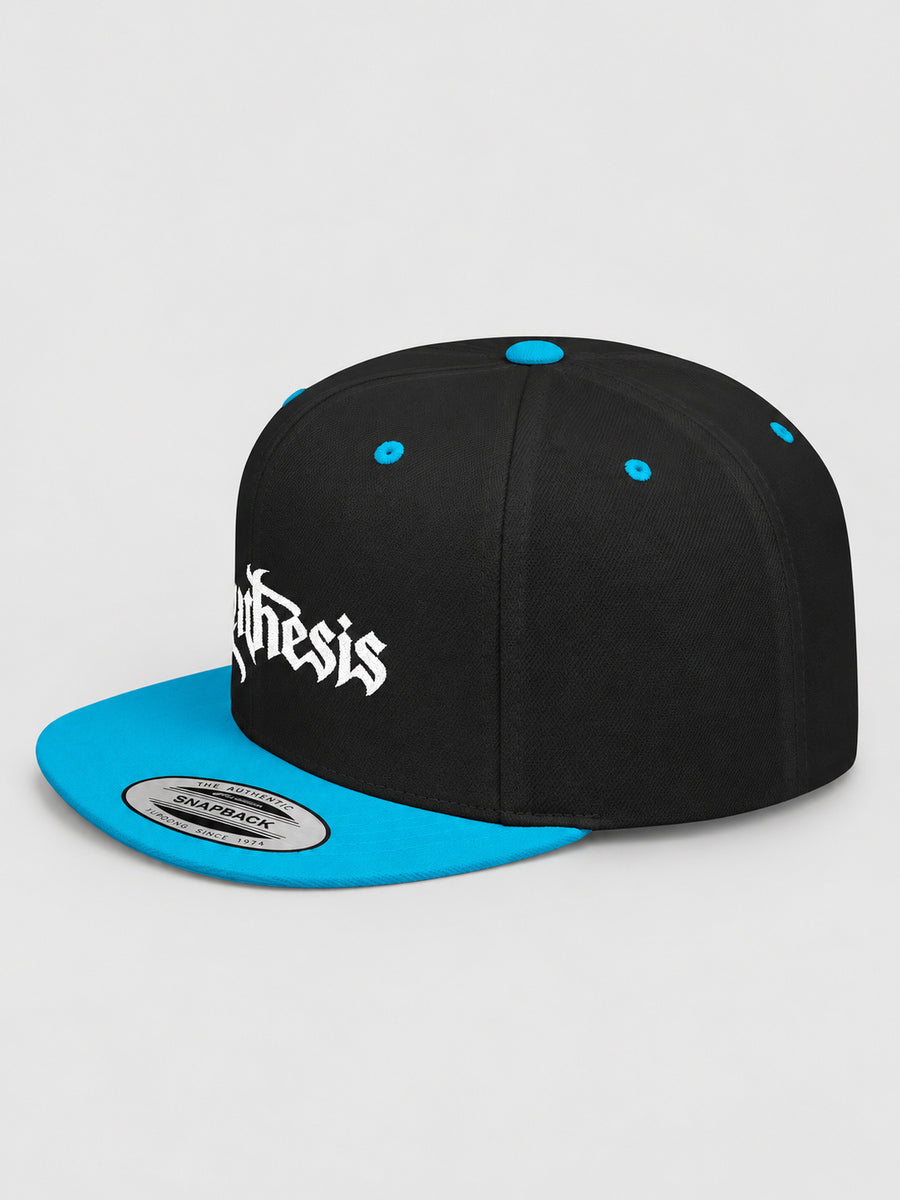 Synthesis Doomed Flat Bill Snapback Hat in Black/Teal, three-quarter studio view with white Gothic embroidery.