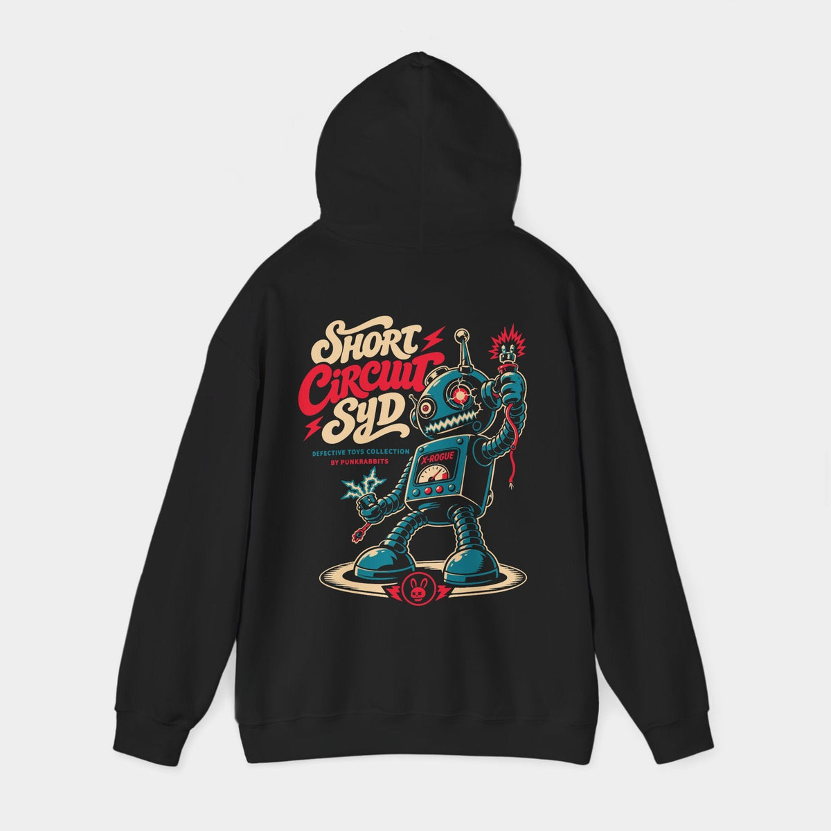 Short Circuit Syd black hoodie, hood-raised back view showing a teal retro toy robot with spring limbs, loose sparking cables, a chest meter and cream-and-red Short Circuit Syd lettering.