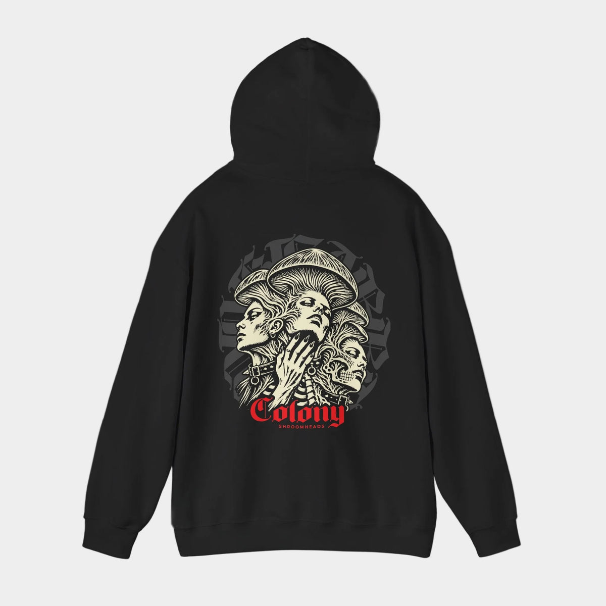 Colony black hoodie with hood raised, back view showing three interwoven mushroom-crowned portraits, a skull and studded collars, with red Colony lettering.