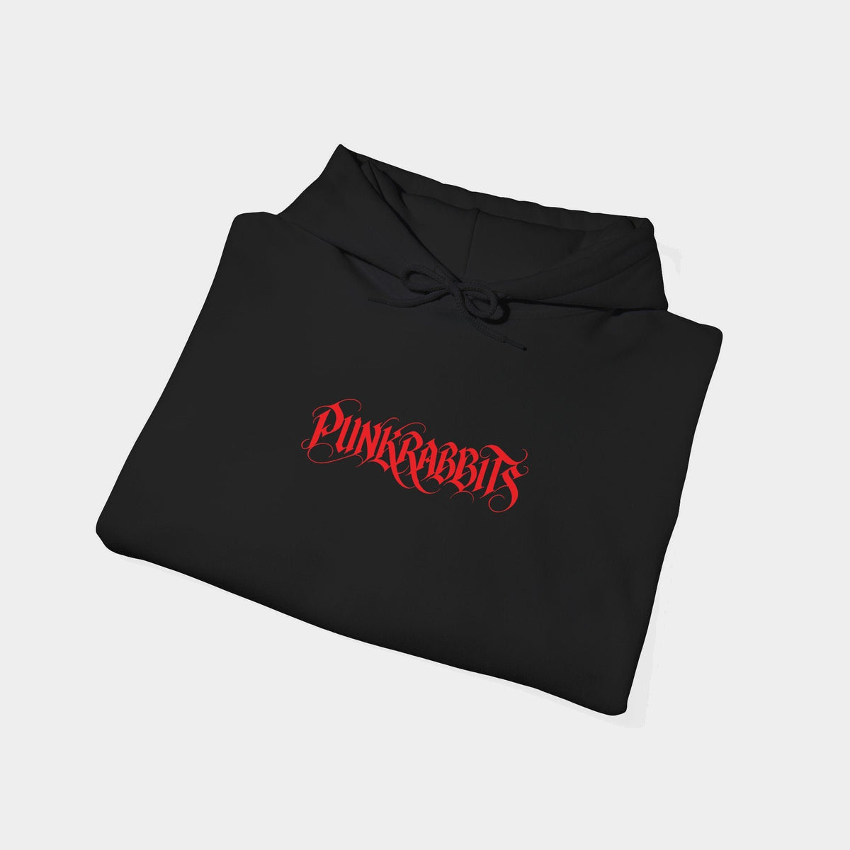 Ecstasis black hoodie folded, showing a compact red Punkrabbits calligraphic wordmark.