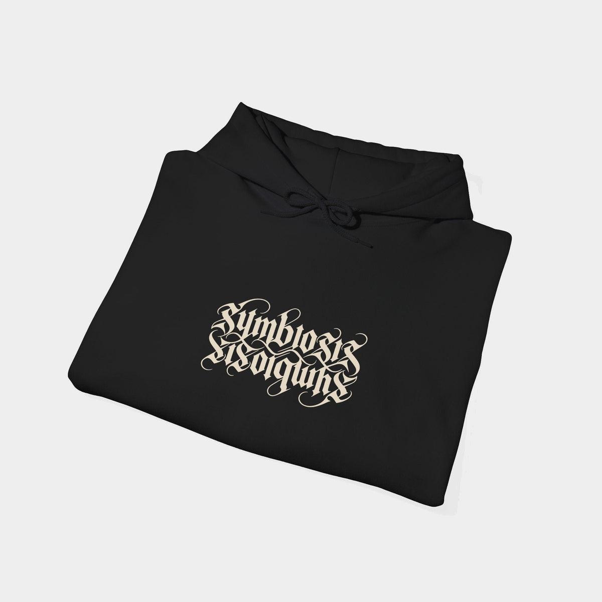 Symbiosis black hoodie folded, showing paired upright and inverted ivory Symbiosis lettering.
