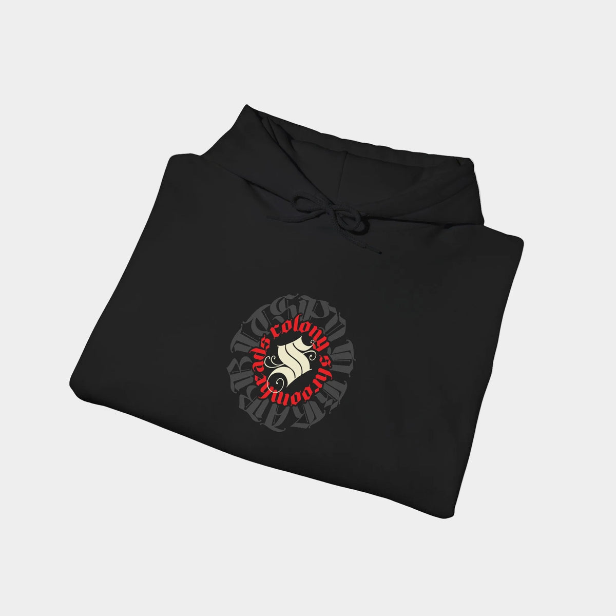 Shroomhead black hoodie folded, showing a round Colony Shroomheads crest in red and ivory over charcoal lettering.