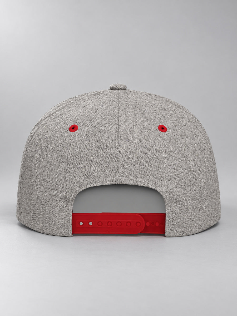Synthesis Blackout snapback in Heather Grey/Red, rear view showing the adjustable snap closure and blank crown on gray.