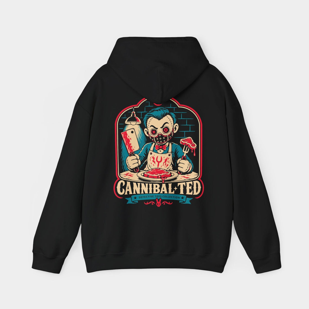 Cannibal Ted black hoodie, back view showing a stitched toy diner character with teal hair, red button eyes, a studded mask, cleaver and steak fork, framed by teal bricks and Cannibal Ted lettering.