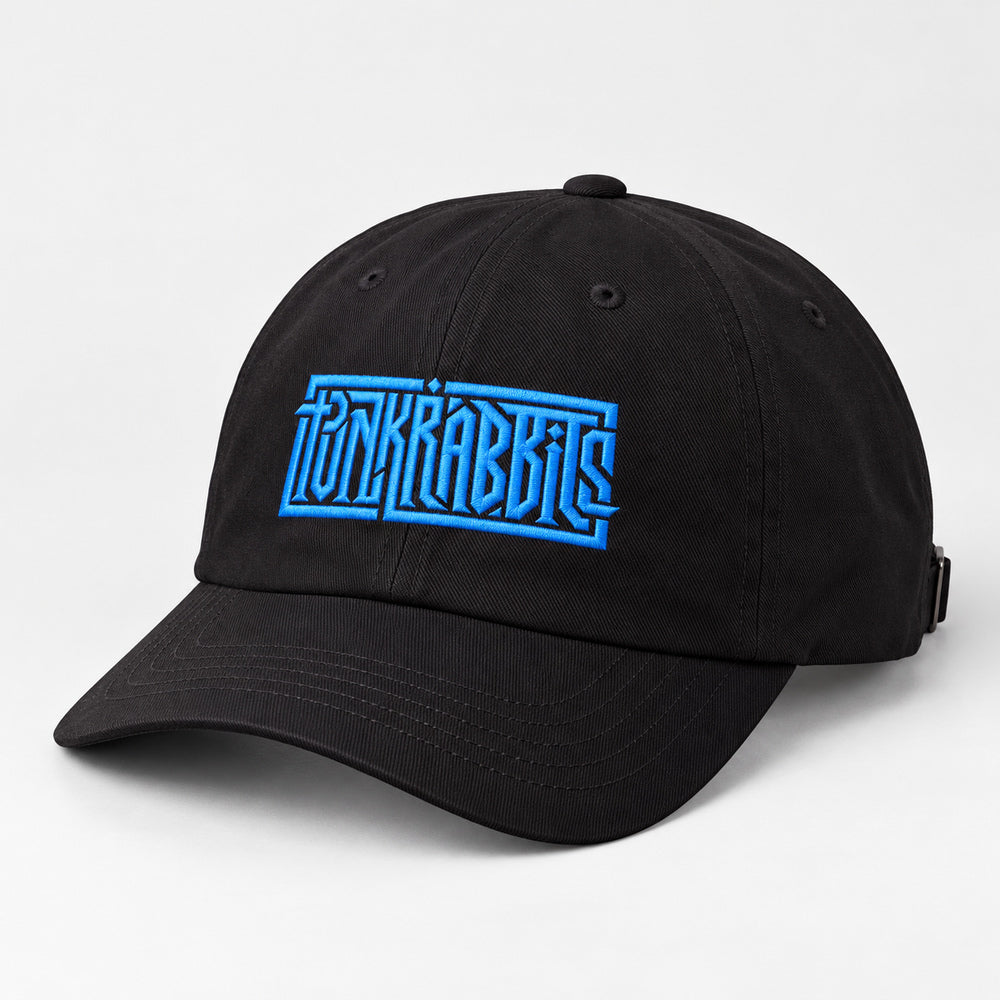 Black curved-brim cap with blue angular Punkrabbits embroidery, three-quarter product view on light gray.