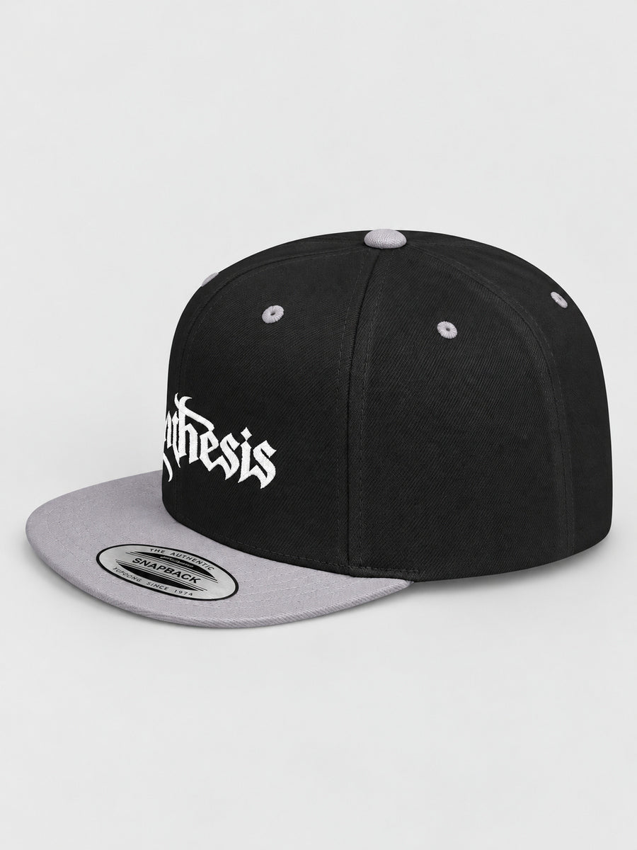 Synthesis Doomed Flat Bill Snapback Hat in Black/Silver, three-quarter studio view with white Gothic embroidery.