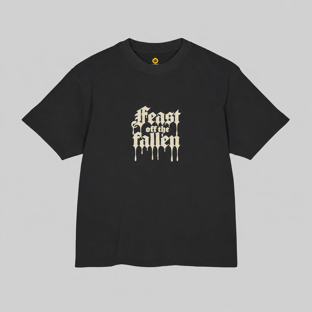 Front of black Feast off the fallen Premium Boxy Tee with ivory dripping blackletter chest print.