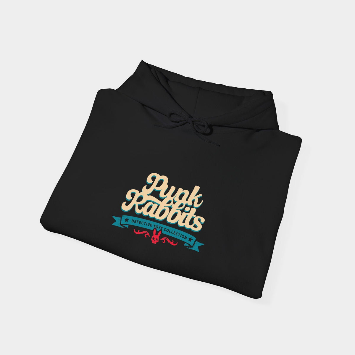 Doctor Dolly black hoodie folded to show cream Punk Rabbits script above a teal banner and small red ornament.
