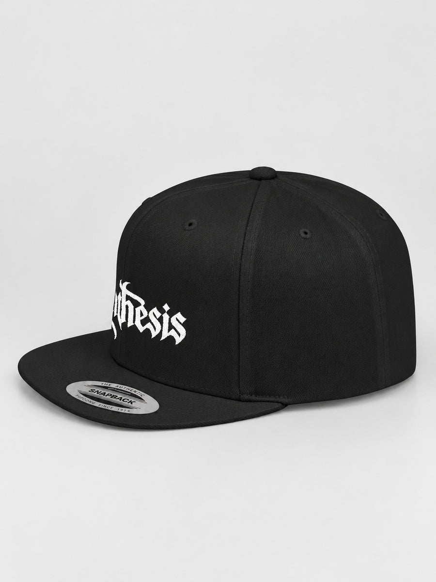 Synthesis Doomed Flat Bill Snapback Hat in Black, three-quarter studio view with white Gothic embroidery.