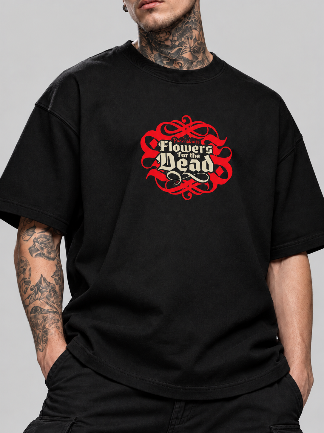 Close-up of black Flowers for the dead Premium Boxy Tee on James, showing the cotton fabric and ornate chest print.