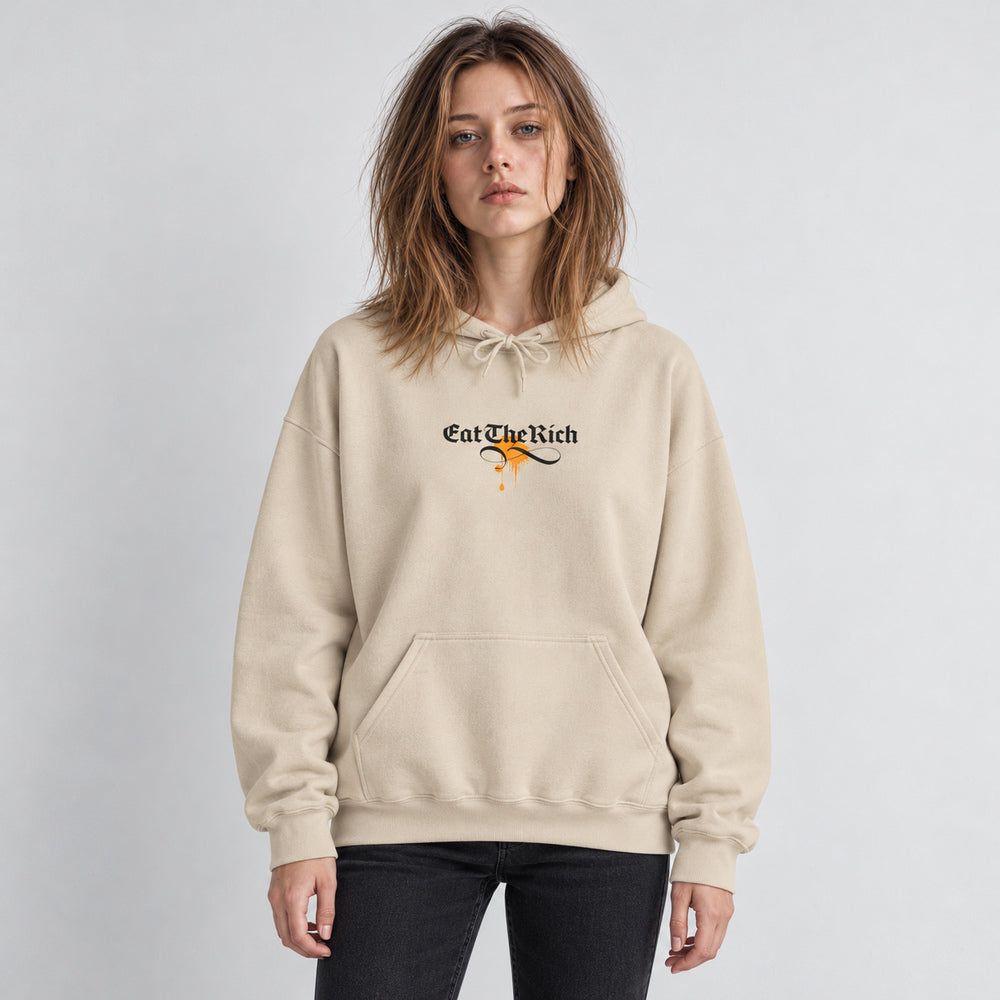 Mara wearing the Sand beige Gilded Thrones Turn to Bones hoodie, front view in a pale gray studio.
