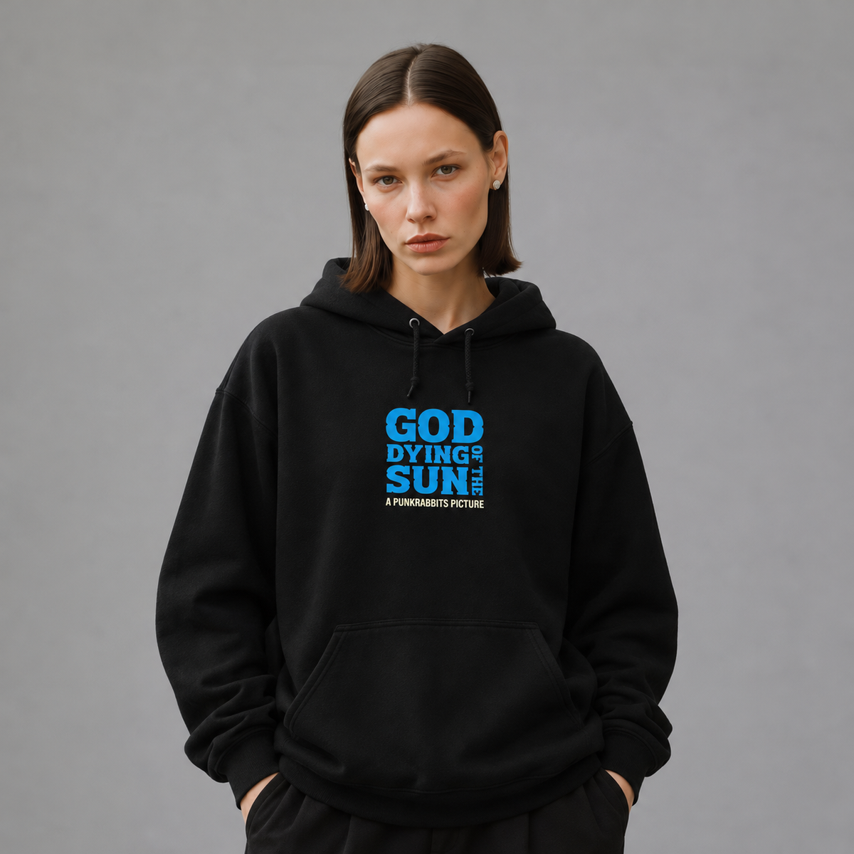 Mara wearing God of the Dying Sun black hoodie, front view — styled mockup