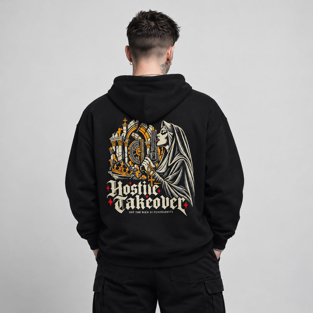 Noah wearing the black Hostile Takeover hoodie, back view showing a veiled nun with an illustrated revolver and gold rosary, beside a jeweled crown and an ornate vault arch; large cream Hostile Takeover lettering and an Eat the Rich by Punkrabbits line sit below.