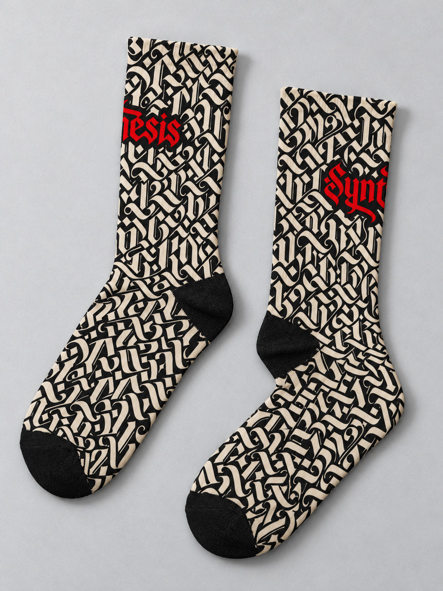 Synthesis script socks: complete sock pair in a styled flat lay.