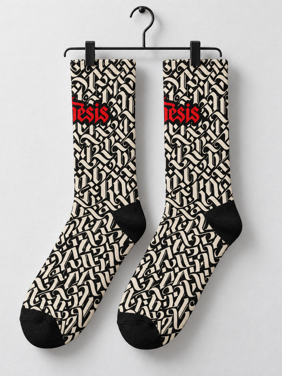 Synthesis script sock pair hanging from black metal clips, first printed view.