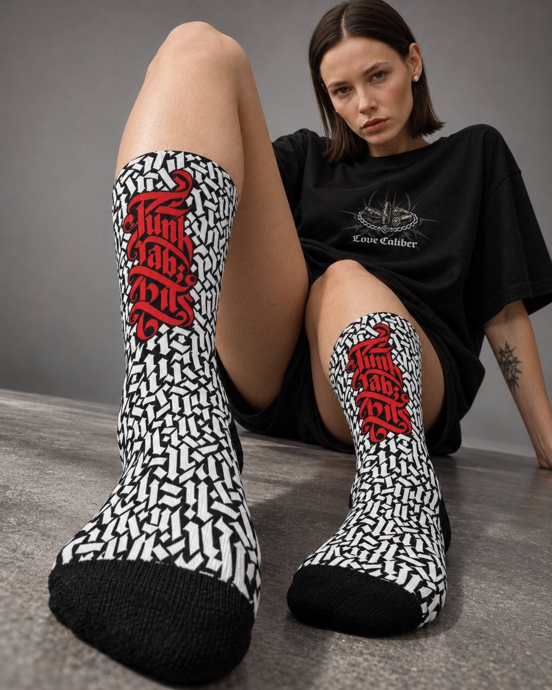 Low-angle view of Mara wearing Punkrabbits Gothic pattern crew socks