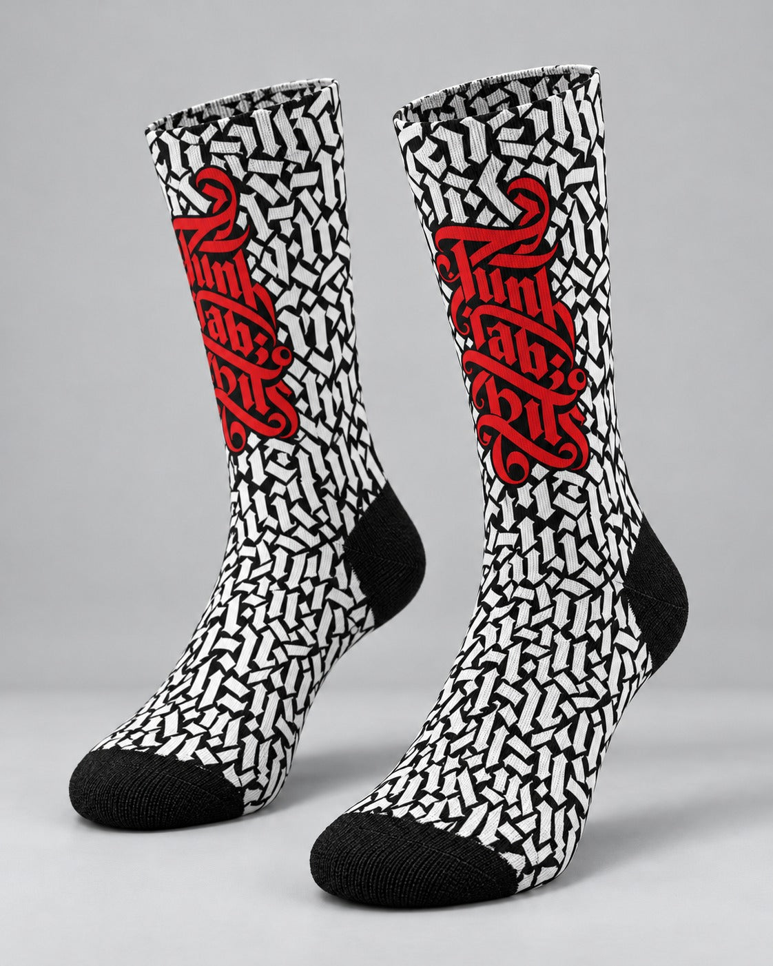 Punkrabbits Red Script crew socks, black and white Gothic pattern with red lettering, studio pair view