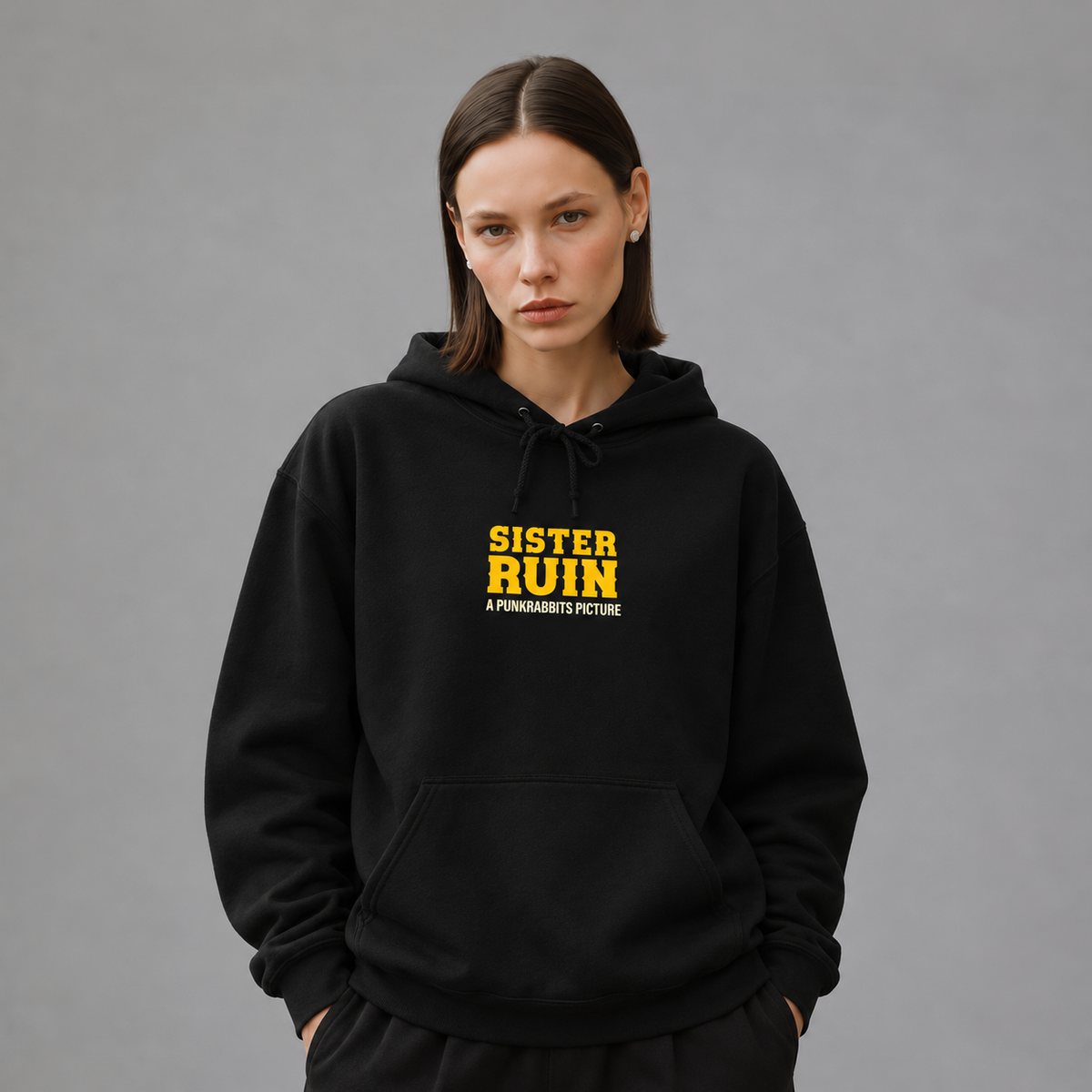 Mara wearing Sister Ruin black hoodie, front view — styled mockup