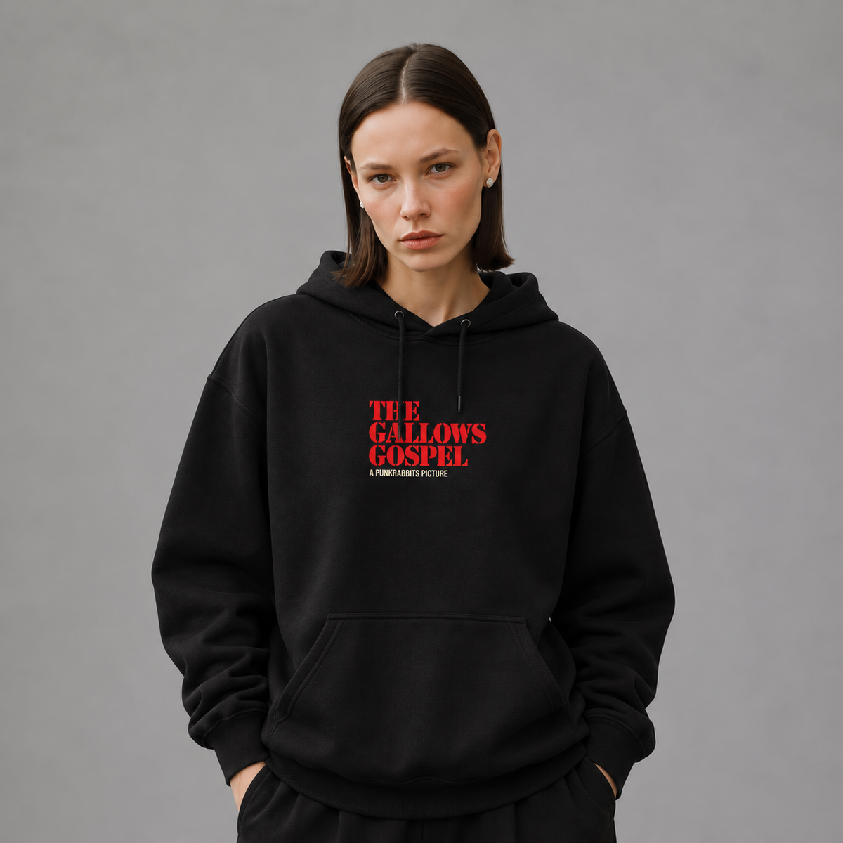 Mara wearing The Gallows Gospel black hoodie, front view — styled mockup